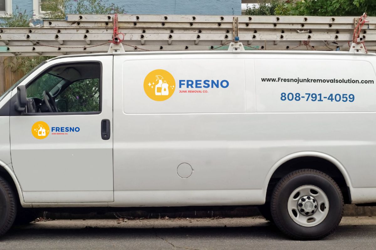 A white van featuring "Fresno" on its side, associated with a junk removal service located in Fresno, California.